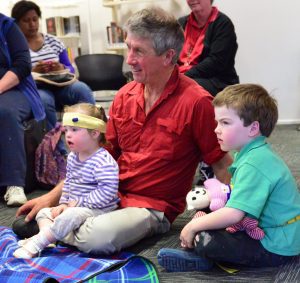 Family with a disabled child attending Teddy Bear storytime