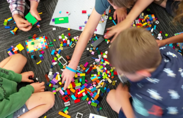 children building with LEGO