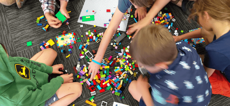 children building with LEGO