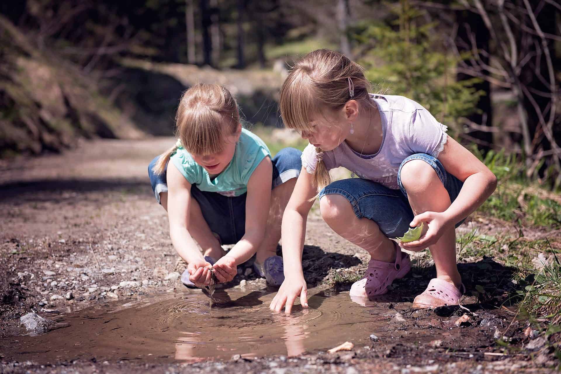 Two children playing in nature